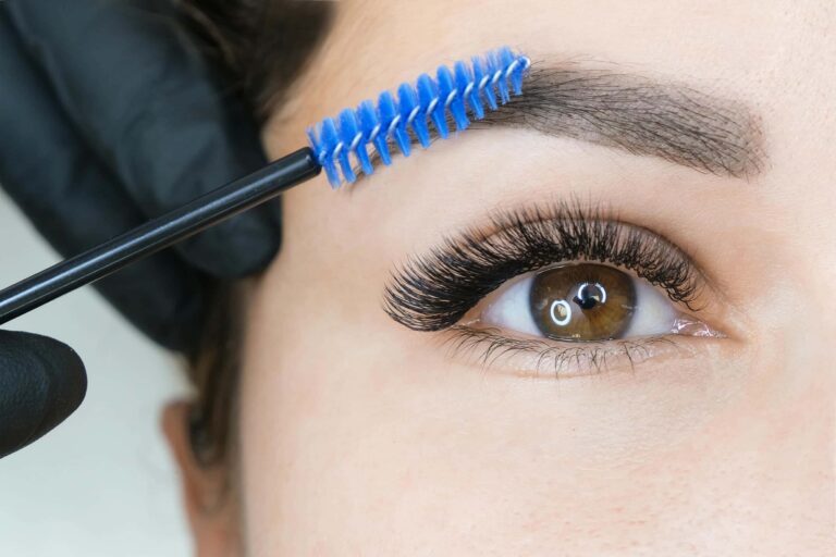 young-woman-shaping-eyebrows-with-brush-close-up_com